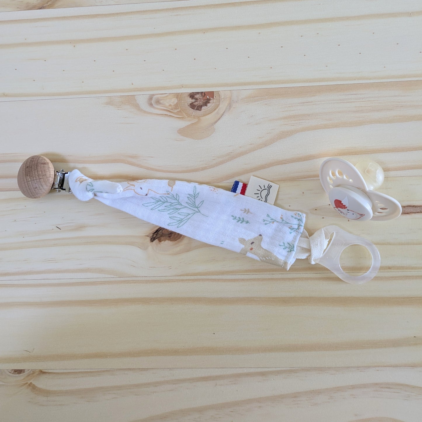 Adaptateur pour l'attache tétine